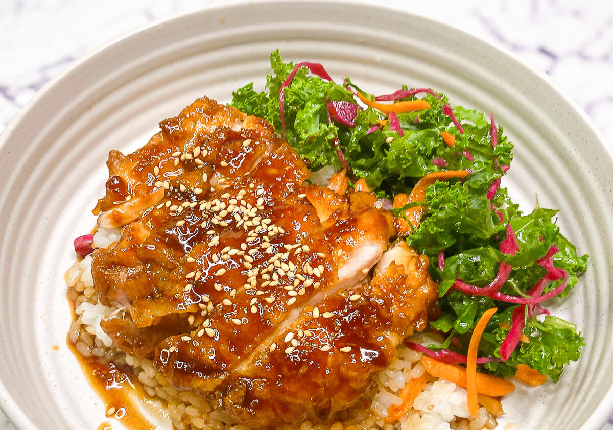 Juicy teriyaki chicken with glossy homemade sauce served over rice with salad