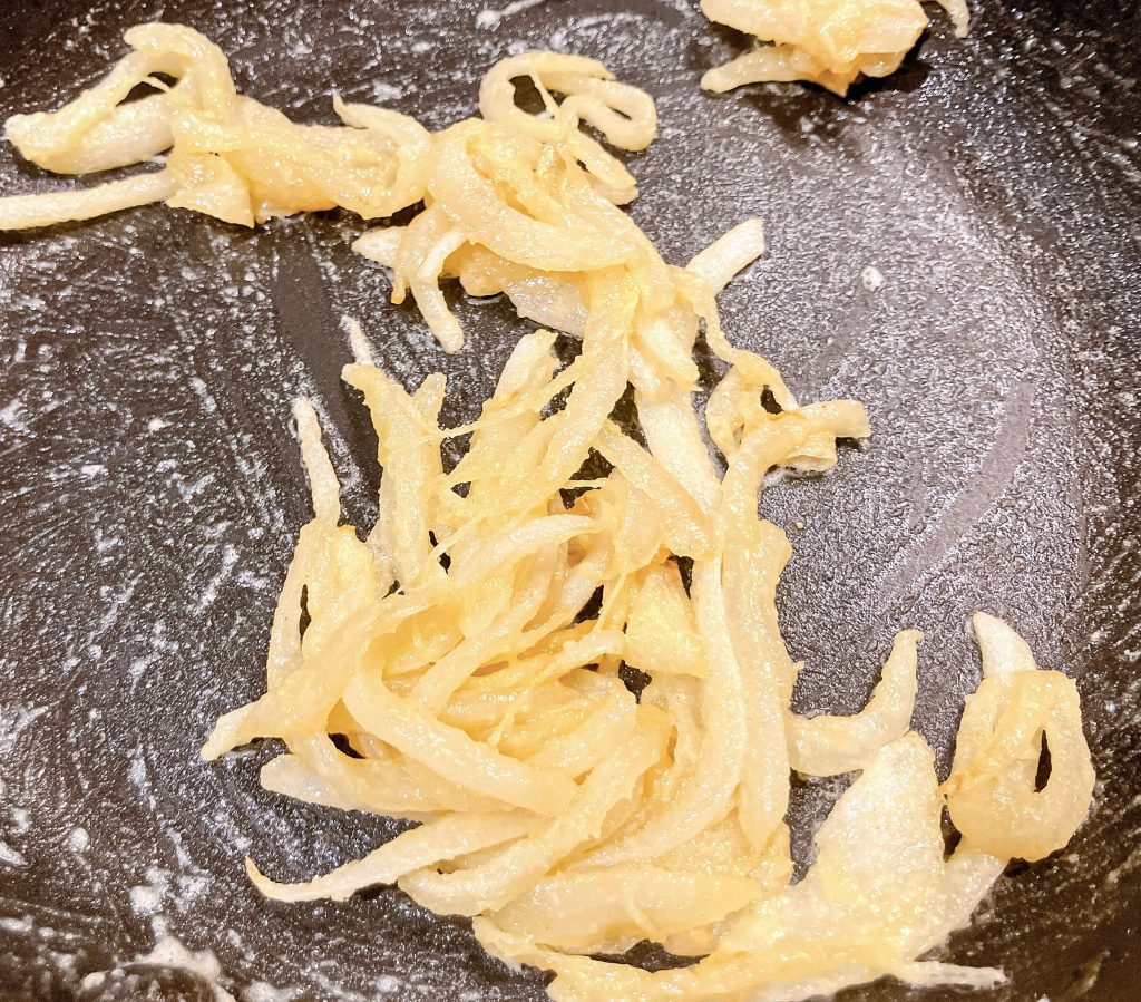 Roux with onions evenly coated and cooked