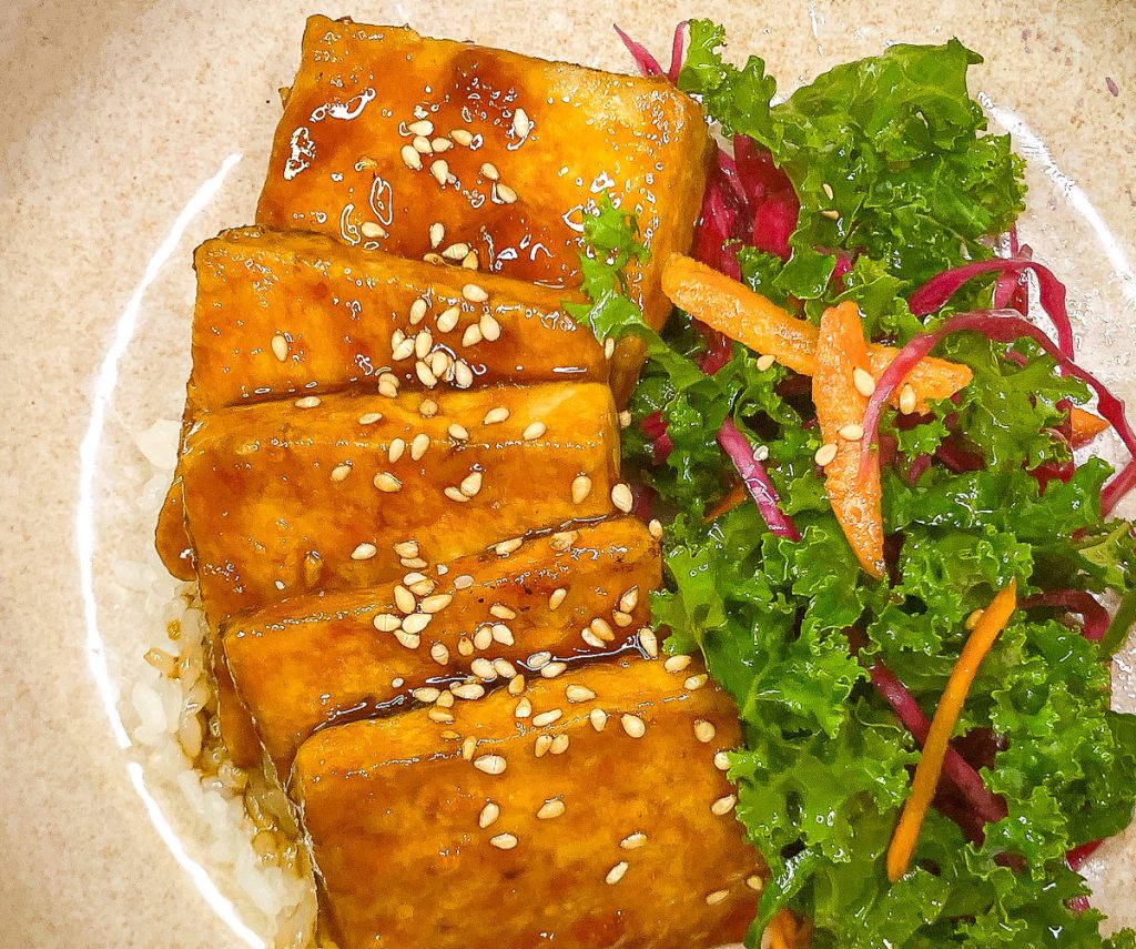 Teriyaki-glazed tofu served with rice and salad — an easy pantry-based dish using no mirin or sake