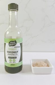 Coconut aminos and raw sugar in a bowl