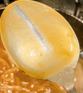 Gravy coating the back of a spoon – correct thickness