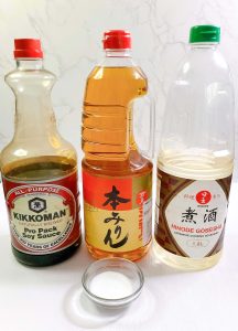 Traditional teriyaki sauce ingredients: soy sauce, mirin, sake, and sugar