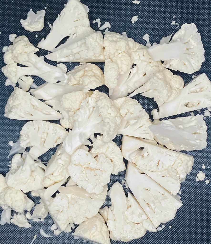 Cauliflower florets prepared and ready to be placed in a food processor to make keto cauliflower rice.”