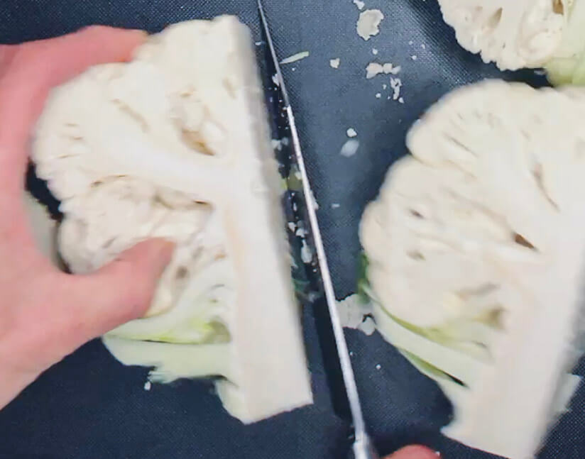 Cauliflower cut into quarters, ready to grate into keto cauliflower rice.