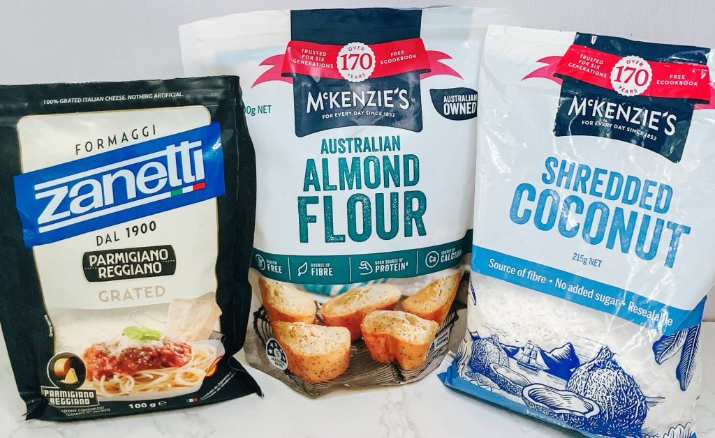 Packaged parmesan, almond flour, and shredded coconut for keto chicken katsu crumb.