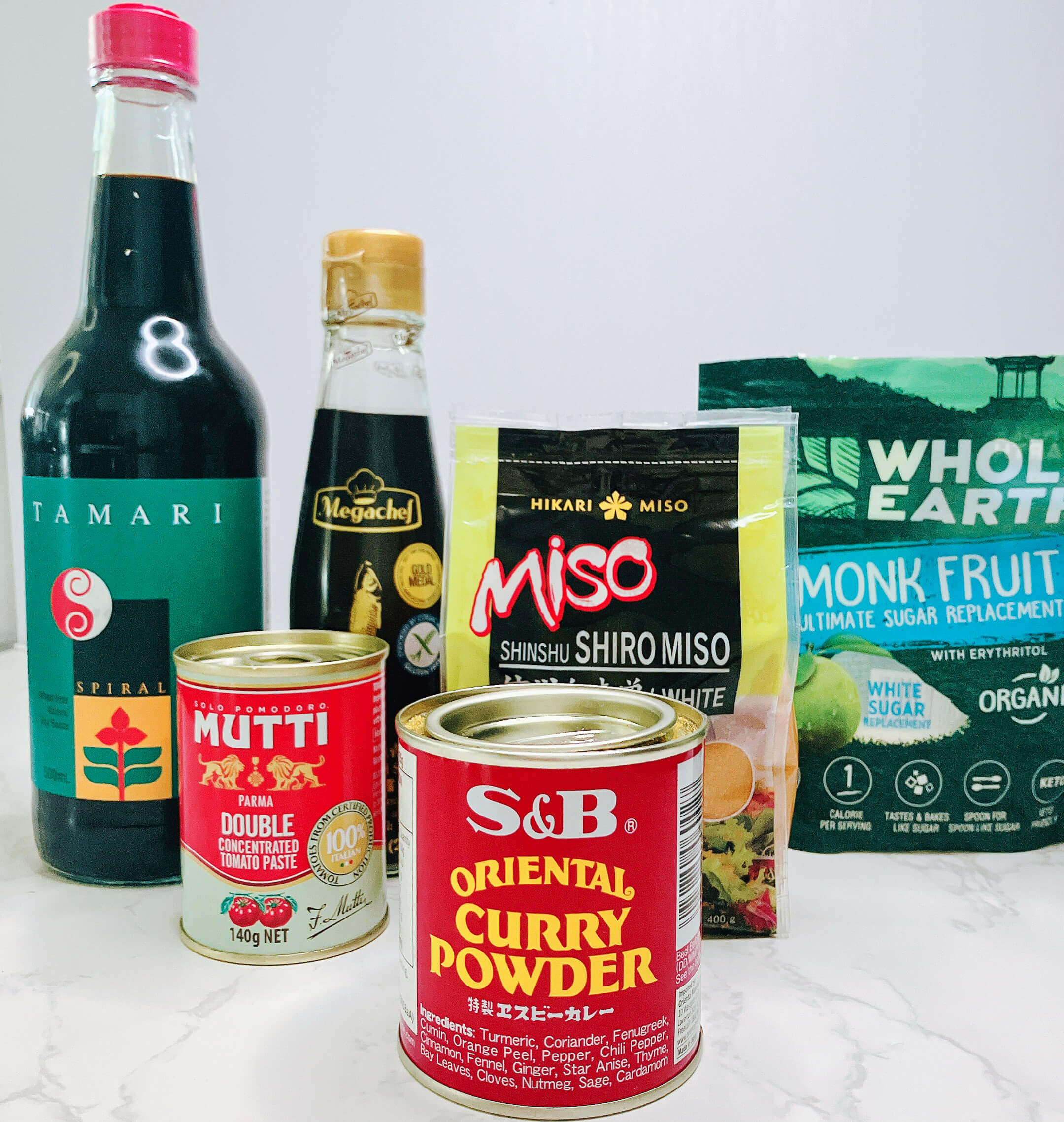 Keto Japanese curry ingredients with tamari, miso, tomato paste, curry powder, coconut aminos, and monk fruit sweetener.