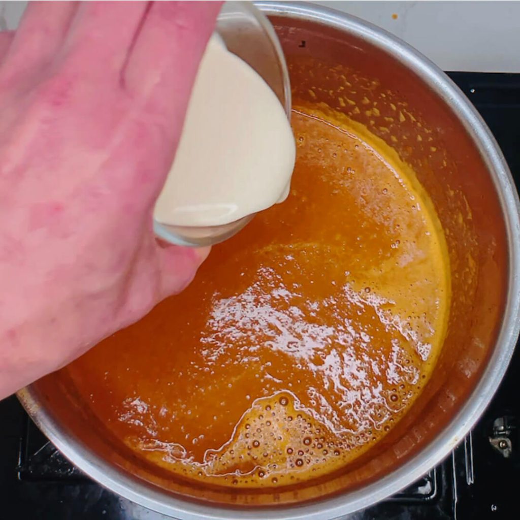 Adding cream to the curry sauce for keto chicken katsu curry.