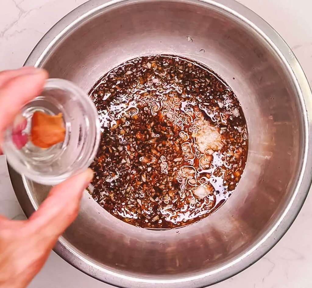 Adding miso, lemon juice and seasonings to onion dressing before oil for brown rice salad