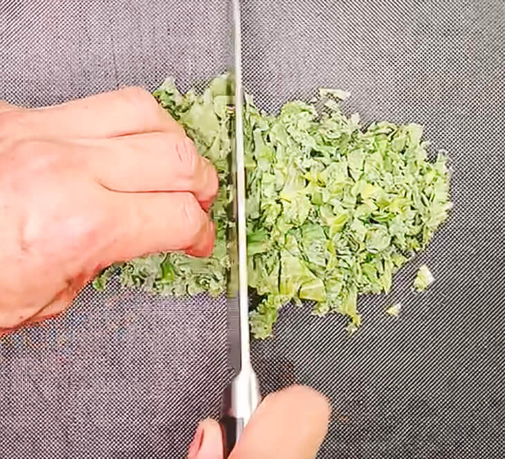 Slicing kale thinly for brown rice kale salad
