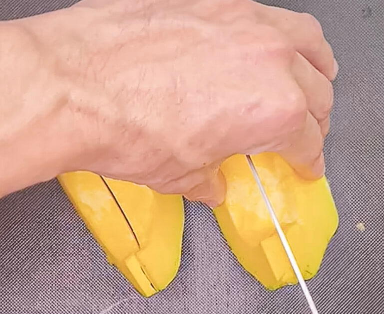 cutting pumpkin into wedges for roasting