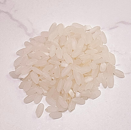 Raw medium grain white rice before cooking