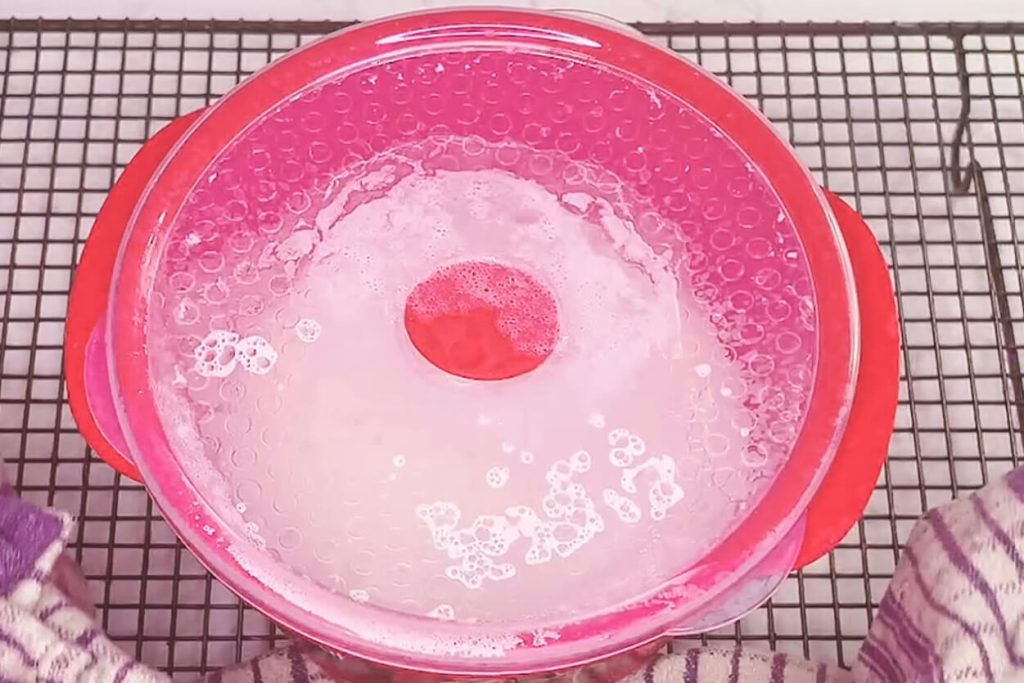 Rice resting in microwave container after cooking
