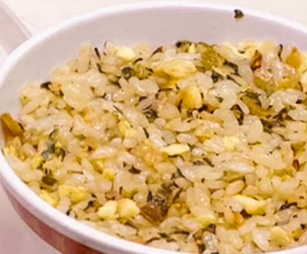 Fried rice pressed into a bowl to mould its shape