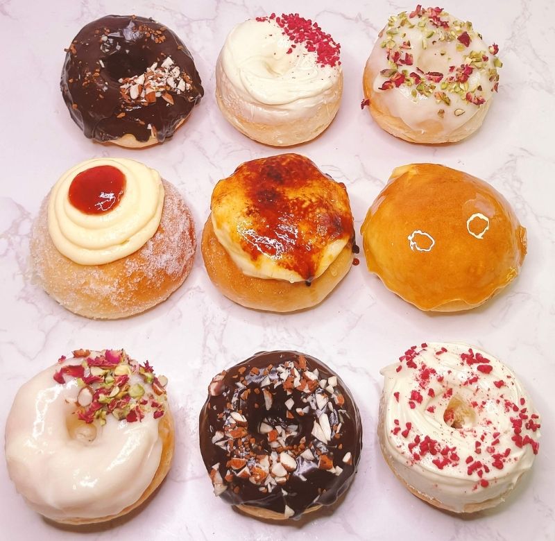 Assorted tangzhong baked donuts with different glazes and toppings